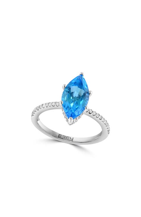 Anillo de oro blanco de 14 quilates con topacio azul marquesa y diamantes - 0,24 ct.