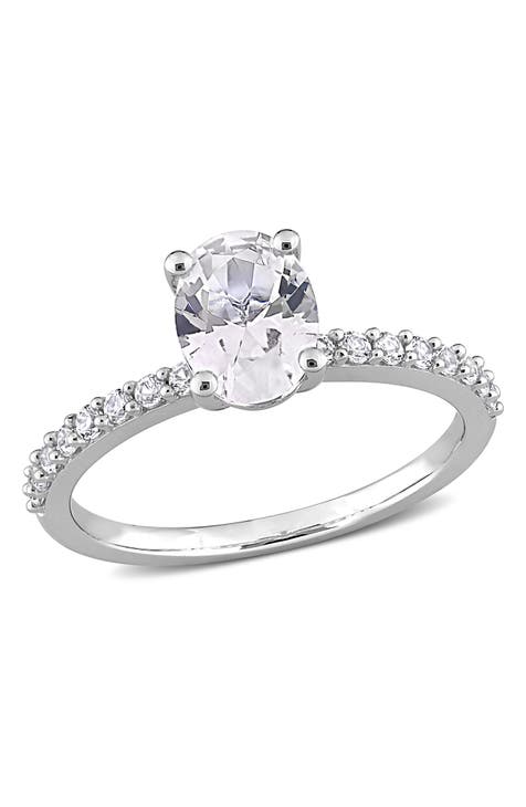 Anillo de plata de ley chapada en oro blanco de 10 quilates con zafiro blanco creado de forma ovalada