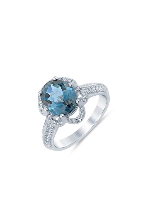 Anillo ovalado de topacio azul de Londres y diamantes - 0,33ct.