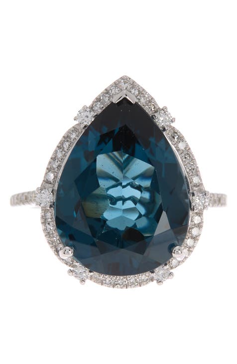 Anillo de oro blanco de 14 quilates con topacio azul pera de Londres y pavé de diamantes