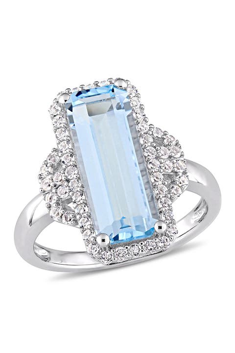 Anillo de plata de ley con topacio azul cielo talla esmeralda y topacio blanco