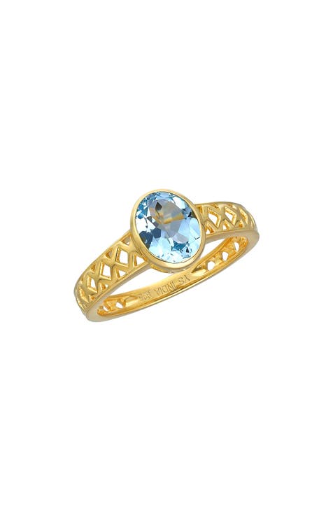 Anillo de topacio azul ovalado chapado en oro de 18 quilates