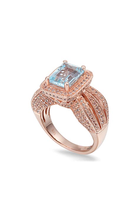 Anillo de plata de ley chapado en oro rosa de 14 quilates con topacio azul talla esmeralda