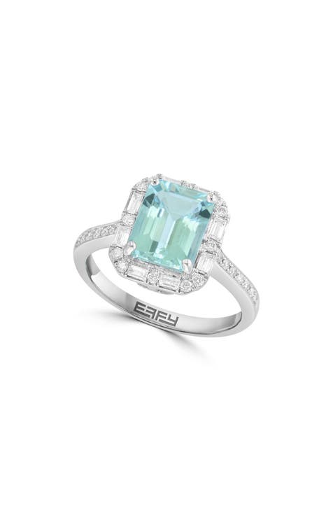 Anillo de oro blanco de 14 quilates con diamantes y aguamarina talla esmeralda