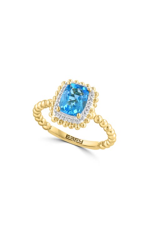 Anillo de diamantes y topacio azul