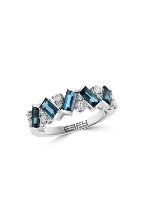 Anillo de oro blanco de 14 quilates con topacio azul de Londres y diamantes - 0,24 ct.
